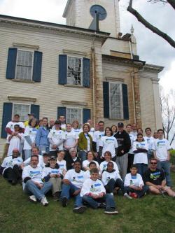 Volunteers from Rebuilding Boston Together take a picture break from work at First Parish Church. 	Tom Burke photo
